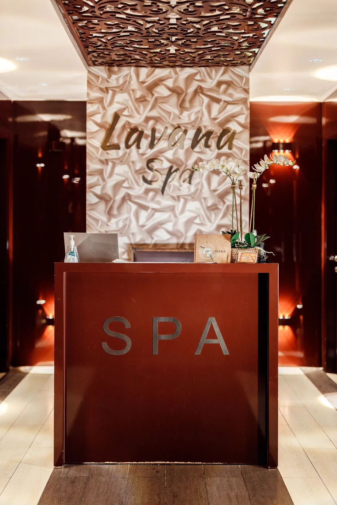 Reception desk at Lavana Spa Al Barsha, with the spa sign above it