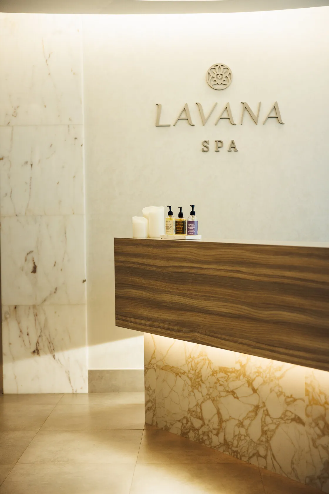 Reception desk and Lavana Spa lettering on the marble wall at the DIFC branch