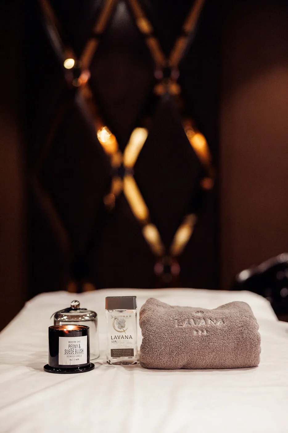 Treatment table made up with towels and a candle at the Al Barsha branch