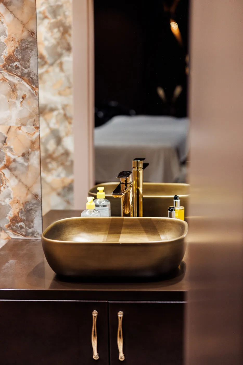 Vanity with a brass basin in the treatment room at Lavana Spa Al Barsha